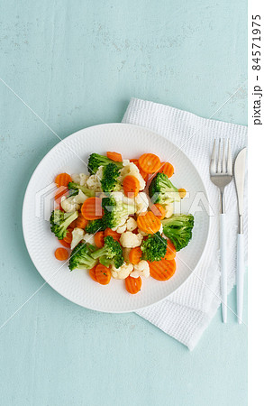 Mix of boiled vegetables. Broccoli, carrots, cauliflower. Steamed vegetables for dietary 84571975