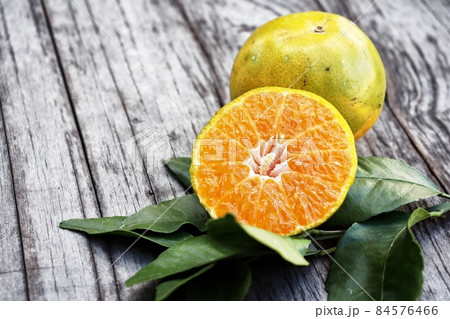 Fresh orange fruit on wood background 84576466