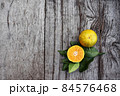 Fresh orange fruit on wood background 84576468