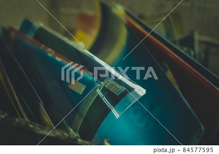 Used photopolymer printing plate in ink. Box with used printing plates. Printing house. Selective focus Used photopolymer printing plate in ink. Box with used printing plates. Printing house. Selective focus 84577595
