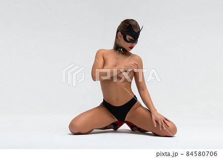 Sensual woman in black mask and underwear 84580706