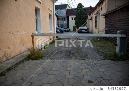 A barrier in a narrow street of a private dwelling. A barrier in a narrow street of a private dwelling. 84582097