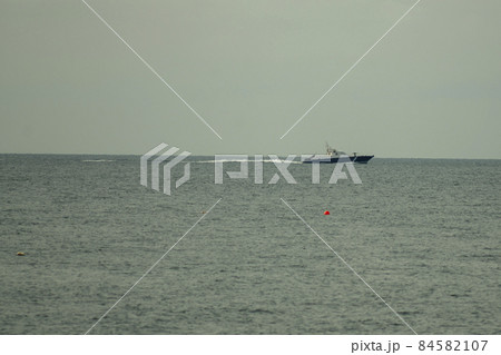 Coast guard boat on the horizon of the sea. 84582107