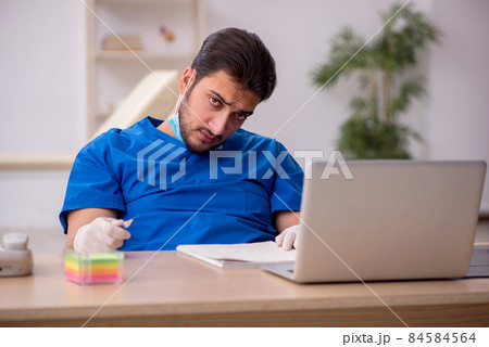 Young male doctor in vaccination concept Young male doctor in vaccination concept 84584564