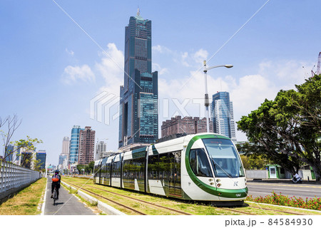 Cityscape of light rail train and the metropolitan building in Kaohsiung, Taiwan. The light rail system in Kaohsiung is the first light rail transit in Taiwan. 84584930