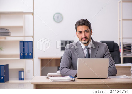 Young male employee working in the office 84586756