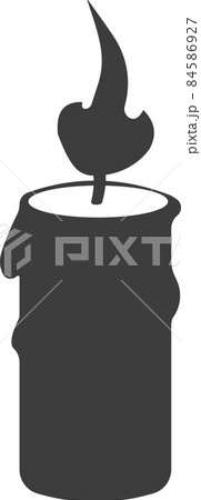 A flat black candle with a burning wick. A flat black candle with a burning wick. 84586927