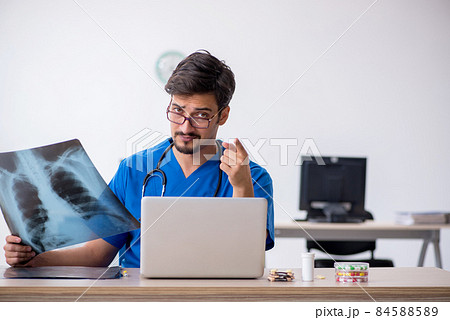 Young male doctor radiologist working in the clinic Young male doctor radiologist working in the clinic 84588589