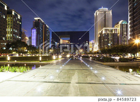 Night view of the square and surrounding modern buildings view in front of Taichung City Hall, Taiwan. It is the highest-level local administrative agency in Taichung. 84589723