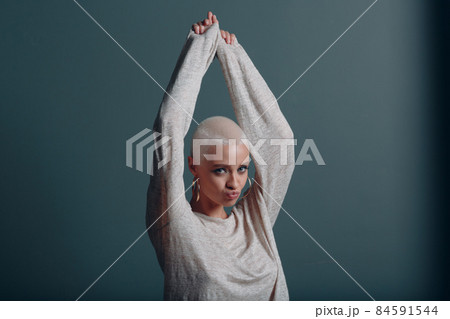 Millenial young woman with short blonde hair portrait. Millenial young woman with short blonde hair portrait. 84591544