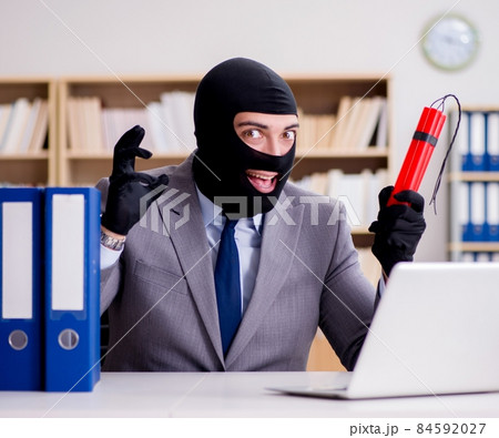 Criminal businessman with balaclava with dynamite 84592027