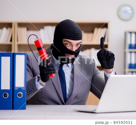 Criminal businessman with balaclava with dynamite 84592031