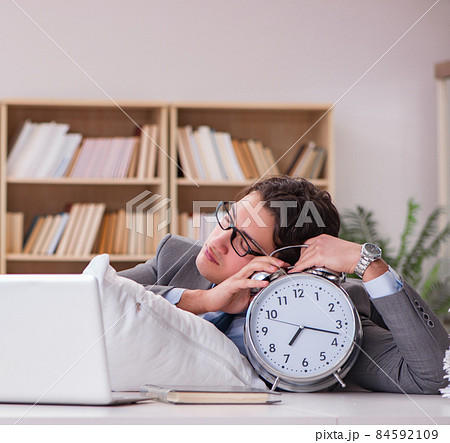 Tired man sleeping at home having too much work Tired man sleeping at home having too much work 84592109