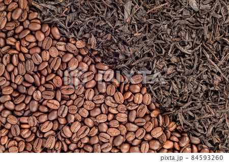 Full frame of roasted coffee beans and tea leaves arranged diagonally. Full frame of roasted coffee beans and tea leaves arranged diagonally. 84593260