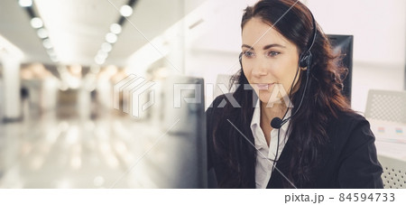 Business people wearing headset working in office broaden view Business people wearing headset working in office broaden view 84594733
