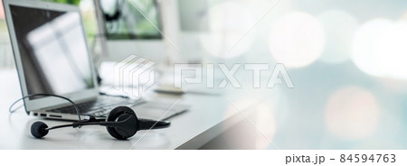 Headset and customer support equipment at call center ready for actively service 84594763