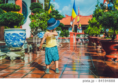 Boy tourist in Buddhist temple in Vietnam Nha Trang Boy tourist in Buddhist temple in Vietnam Nha Trang 84594888
