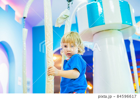 Young boy thrilled on the carousel ride 84596617