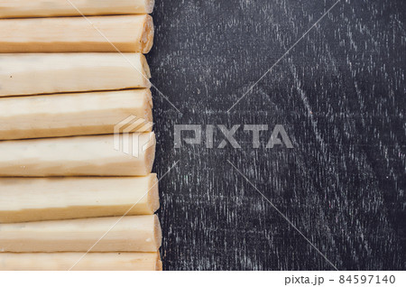 Pieces of cane sugar on the old wooden background. Sugar concept Pieces of cane sugar on the old wooden background. Sugar concept 84597140