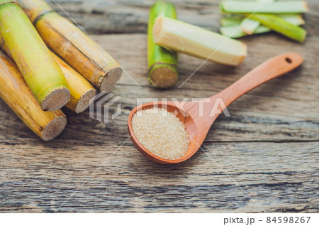 Granulated brown sugar produced from sugar cane. Agriculture Industry concept 84598267
