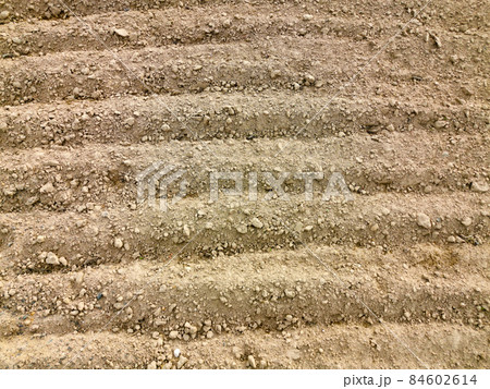 Landscape plowed field. Arable land. Beautiful background. 84602614
