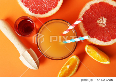 Concept of cooking Tequila sunrise cocktail on orange background Concept of cooking Tequila sunrise cocktail on orange background 84603286