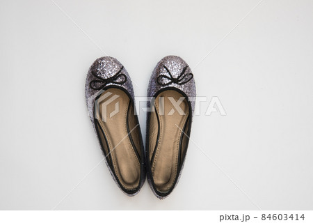 Elegant holiday shoes. View from above. Shiny shoes for a special day. Christmas shoes for the holiday. Iridescent sequins Elegant holiday shoes. View from above. Shiny shoes for a special day. Christmas shoes for the holiday. Iridescent sequins 84603414