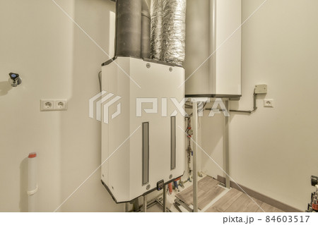 An electric dashboard with cables in a small room 84603517