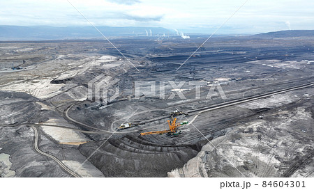 Brown coal opencast mine bucket wheel excavator giant Vrsany, aerial video shot view, open pit lignite heavy quarry, mining power plants burn energetics, dumpers quarrying extractive, extraction Czech Brown coal opencast mine bucket wheel excavator giant Vrsany, aerial video shot view, open pit lignite heavy quarry, mining power plants burn energetics, dumpers quarrying extractive, extraction Czech 84604301