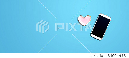 Smartphone with heart shaped dish Smartphone with heart shaped dish 84604938