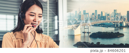 Businesswoman wearing headset working actively in office Businesswoman wearing headset working actively in office 84606201