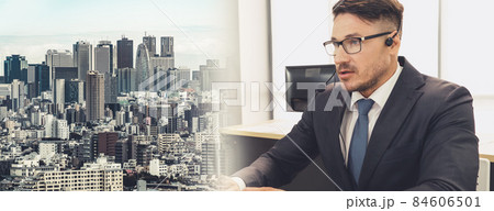 Business people wearing headset working in office broaden view Business people wearing headset working in office broaden view 84606501