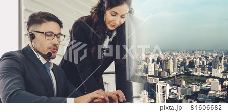 Business people wearing headset working in office broaden view 84606682