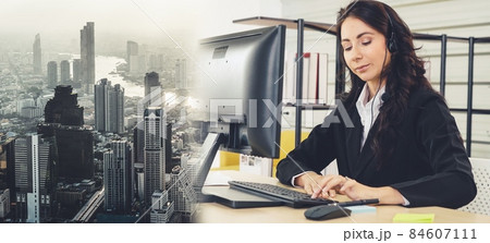 Business people wearing headset working in office broaden view Business people wearing headset working in office broaden view 84607111