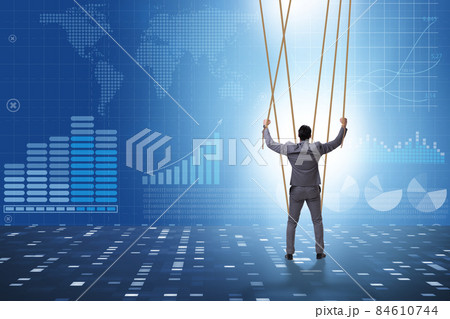 Businessman puppet being manipulated by ropes Businessman puppet being manipulated by ropes 84610744