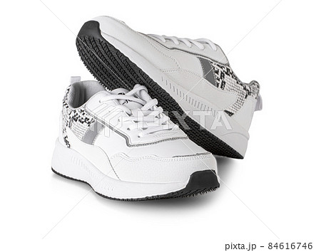 Pair of white woman style sport shoes isolated on whiite background with clipping path Pair of white woman style sport shoes isolated on whiite background with clipping path 84616746