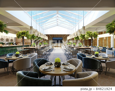 Luxurious restaurant with palm trees inside with a large glass atrium with wooden walls and fashionable furniture. 84621924