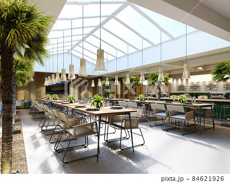 Luxurious restaurant with palm trees inside with a large glass atrium with wooden walls and fashionable furniture. 84621926