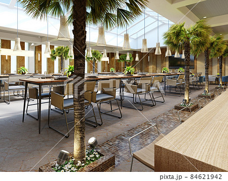 Luxurious restaurant with palm trees inside with a large glass atrium with wooden walls and fashionable furniture. 84621942