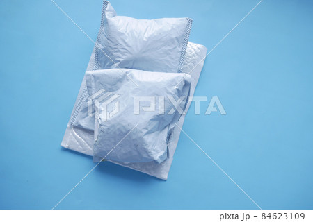 white paper bubble envelope on blue background white paper bubble envelope on blue background 84623109