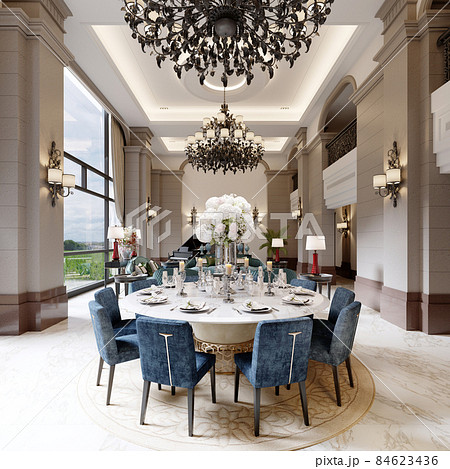 Large luxurious dining table in the large living room with high ceilings in a modern classic style with blue chairs and a white table. 84623436