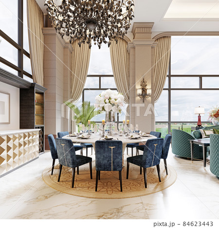 Large luxurious dining table in the large living room with high ceilings in a modern classic style with blue chairs and a white table. 84623443