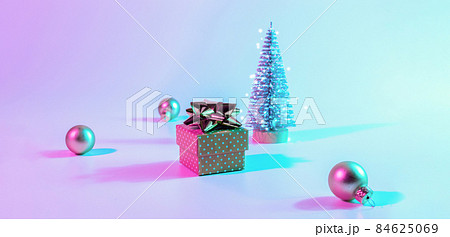 Christmas composition neon. Holiday decoration bauble ball on neon gradient backdrop. Minimal abstract tree, xmas gift box. New year banner. Christmas composition neon. Holiday decoration bauble ball on neon gradient backdrop. Minimal abstract tree, xmas gift box. New year banner. 84625069