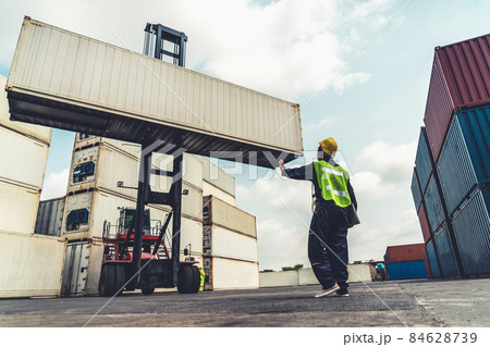Young African American woman worker at overseas shipping container yard 84628739