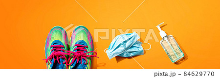 Fitness and coronavirus theme with running shoes 84629770