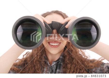 Attractive smiling young girl with binoculars Attractive smiling young girl with binoculars 84631073