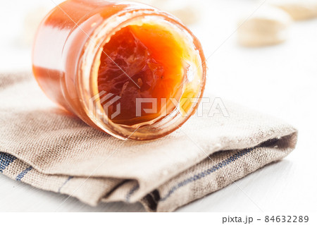 dense jam in jar spoon 84632289
