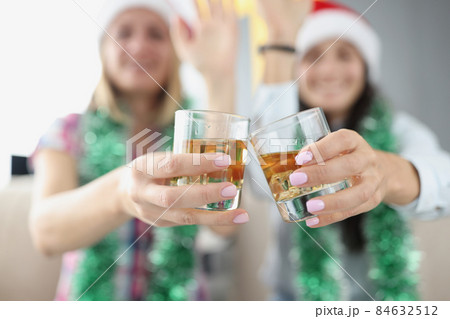 Best friends doing clink with glasses filled with tasty champagne drink Best friends doing clink with glasses filled with tasty champagne drink 84632512