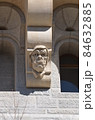 Gargoyle grimaces as building decoration 84632885