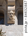 Gargoyle grimaces as building decoration 84632887